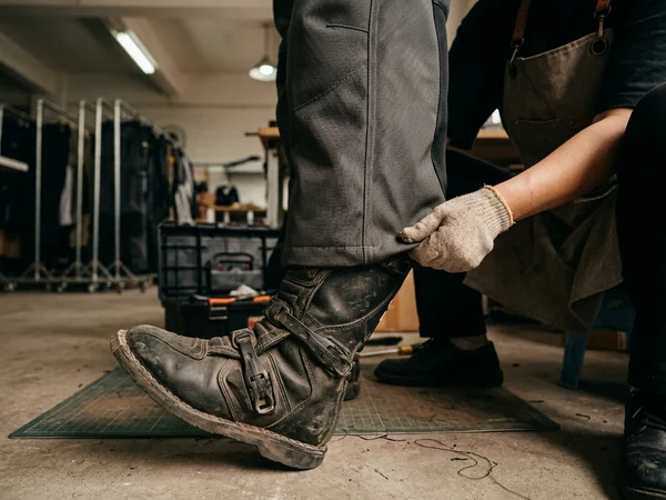 Leg opening of the sample pant tucked inside the riding boot