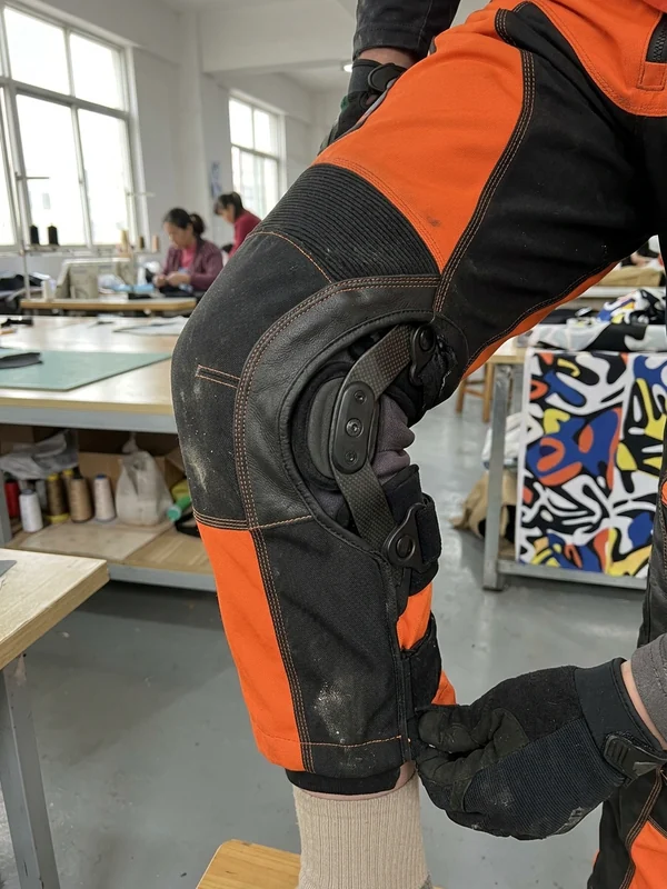 Knee brace inside brace-ready custom mx pants with the knee bent