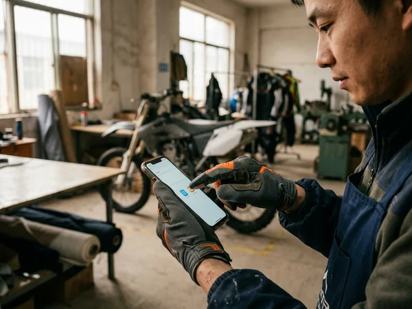 Touchscreen fingertip of the sample glove working on a phone